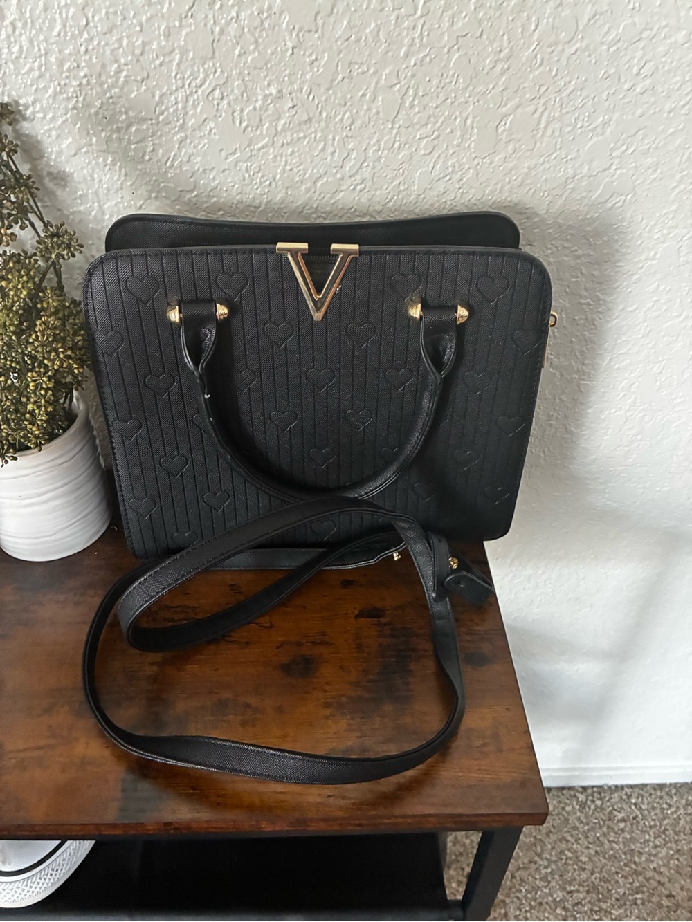 Black Structured Heart-Embossed Satchel with Gold V Accent